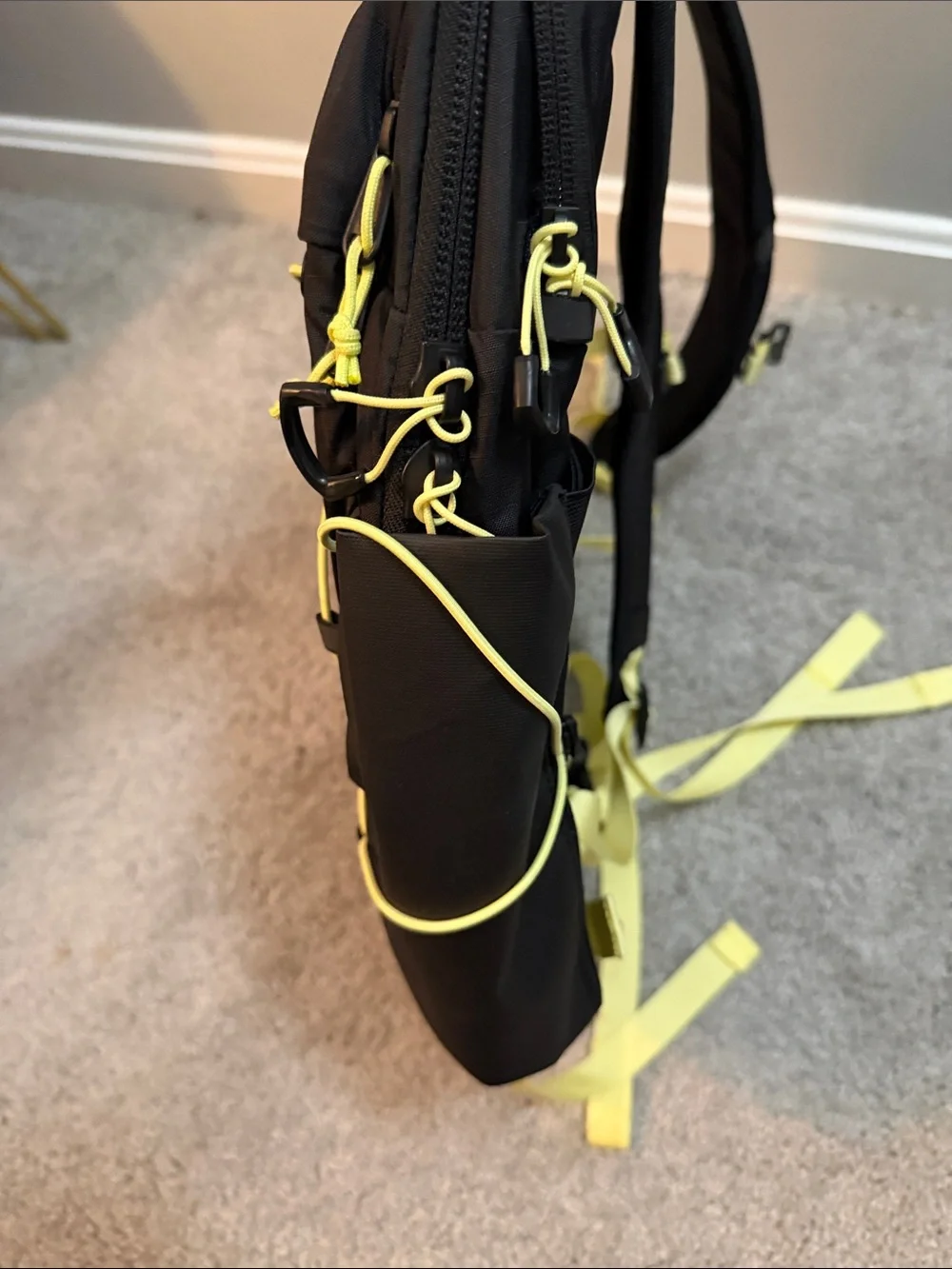 The North Face Black Backpack with Yellow Bungee and Straps